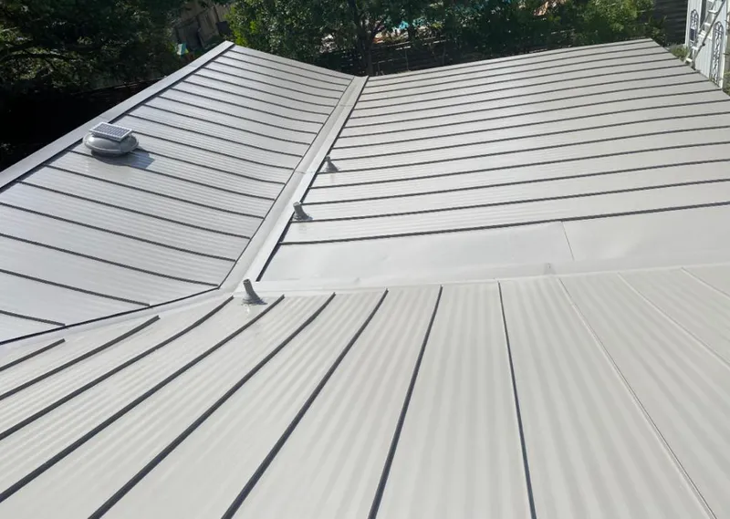 Solar attic fan installed on a metal roof for Roof Ventilation in Lake Forest
